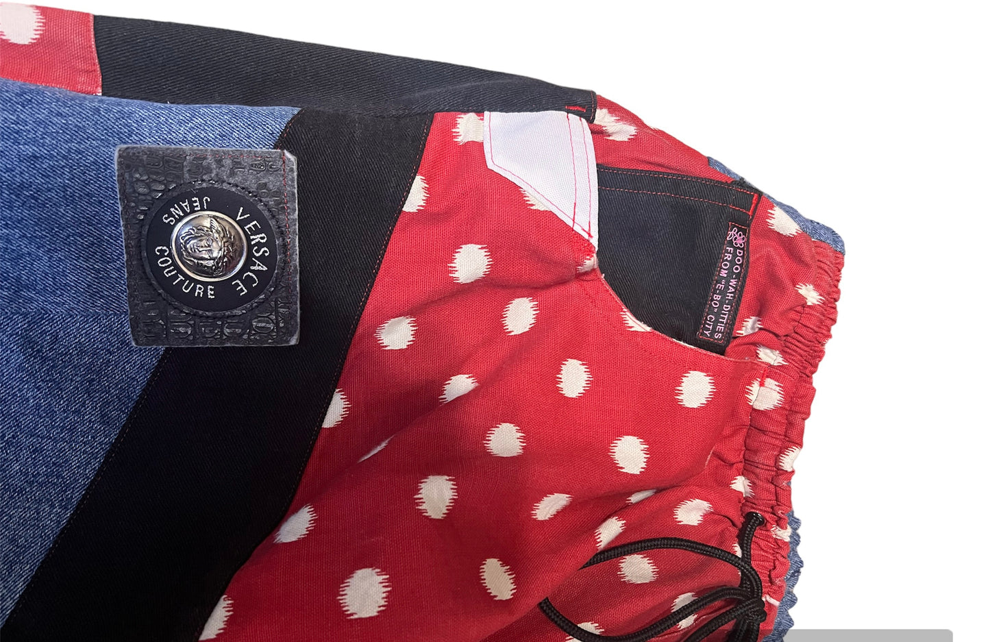 Reworked Versace and black denim with red velvet accents