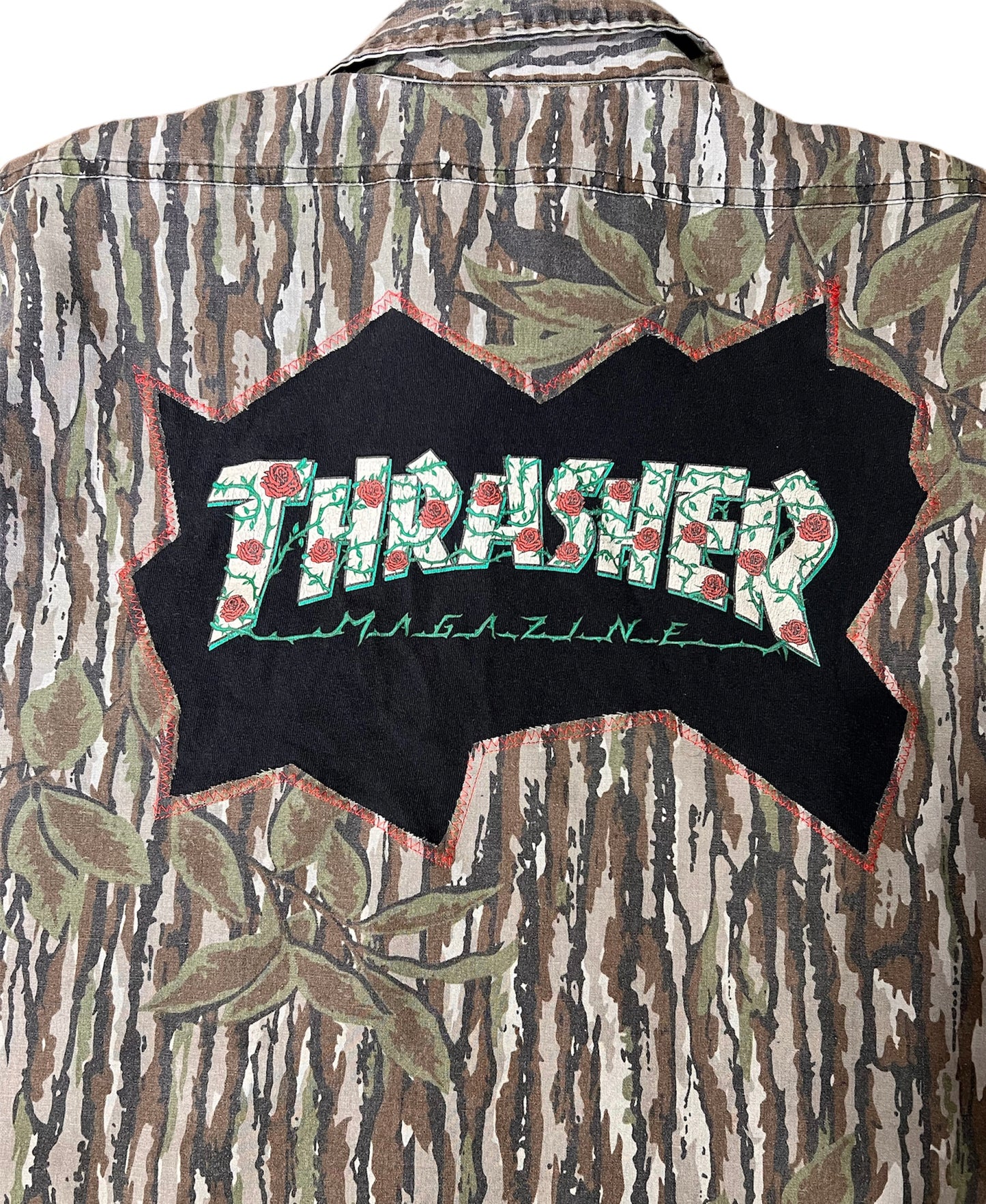 Reworked thrasher t-shirt and real-tree button up hunting shirt.
